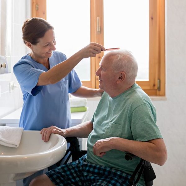 Caretaker-brushing-hair-scaled-1 Caretaker-brushing-hair-scaled-1